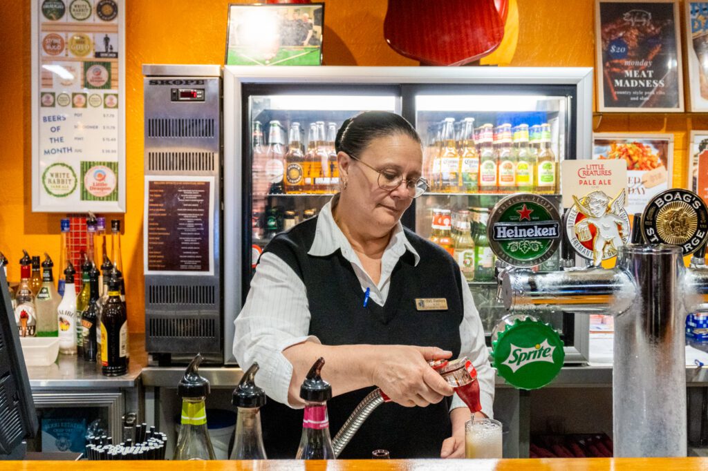 Kim making a lemon lime bitters in Millers Sports Bar