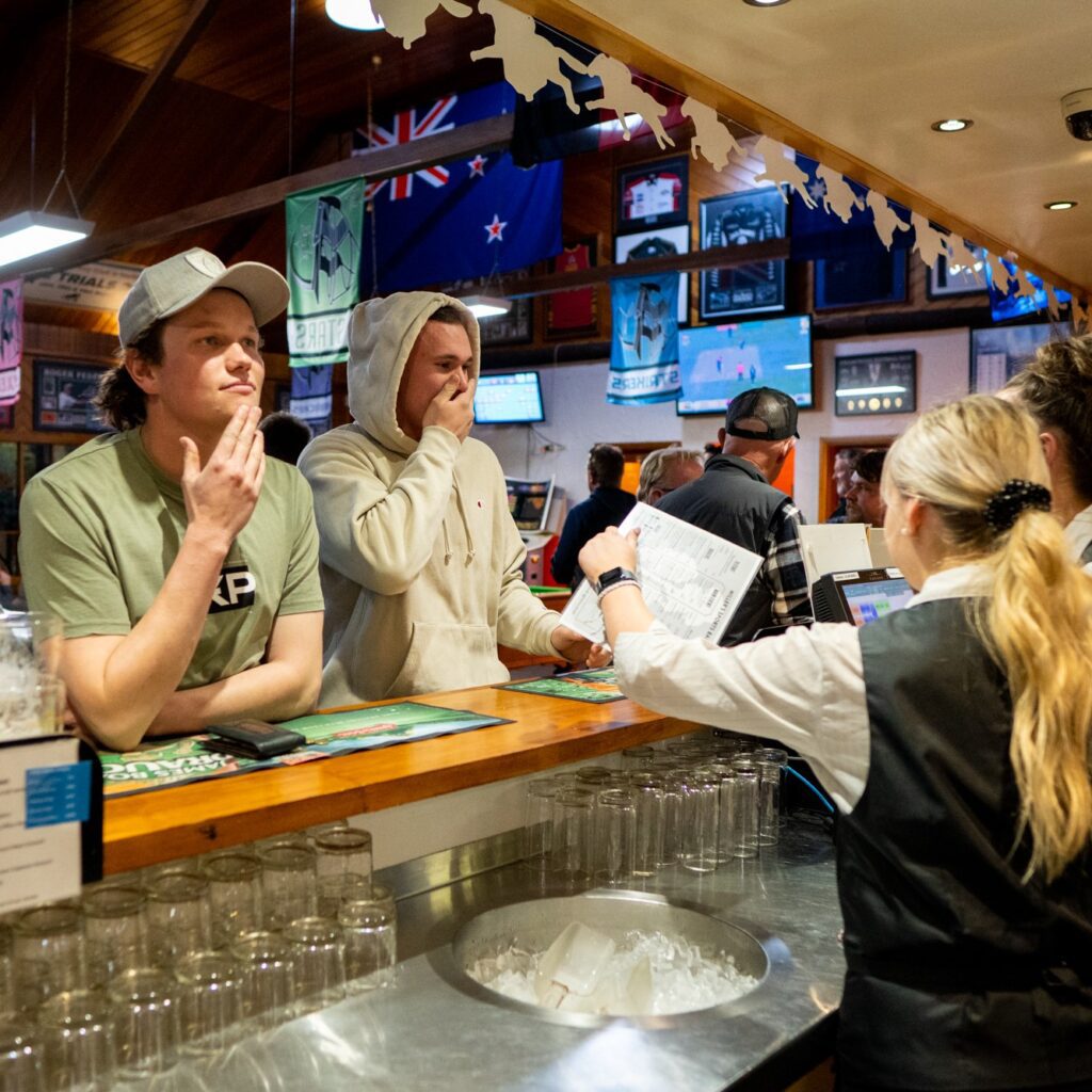 Locals being served at Millers Sports Bar on Draw night